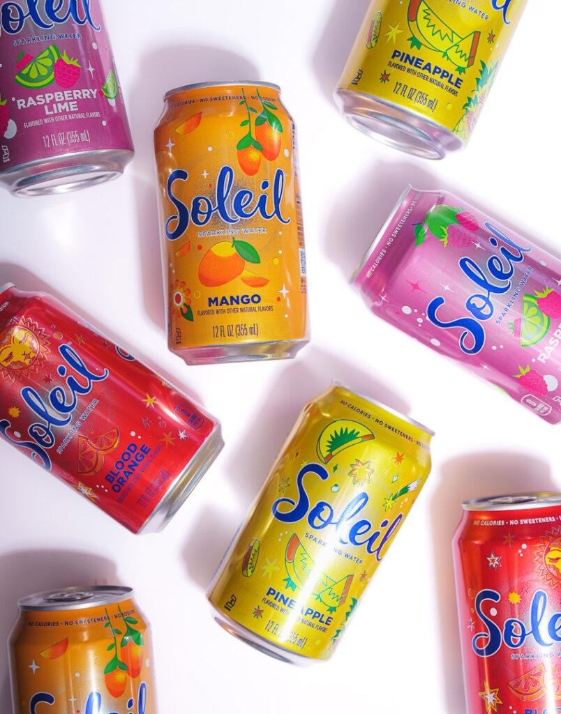 7 Ways a Brand Photoshoot Can Save You Time Creating Social Media Content 9 8 cans of Soleil laying on their sides on a white background.