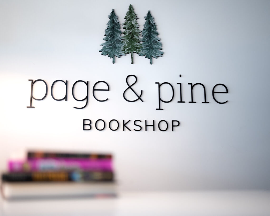 Books sitting on counter with client's branding clearly shown in background
