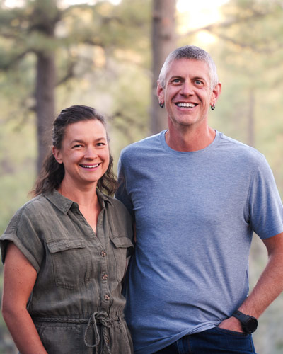 Jason and Debbie Kudlo of Elemental Brand Photo in front of trees