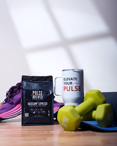 Pulse brewed coffee sits with a selection of workout gear