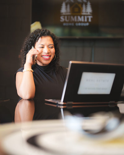 Summit Home Group on a phone call in the office