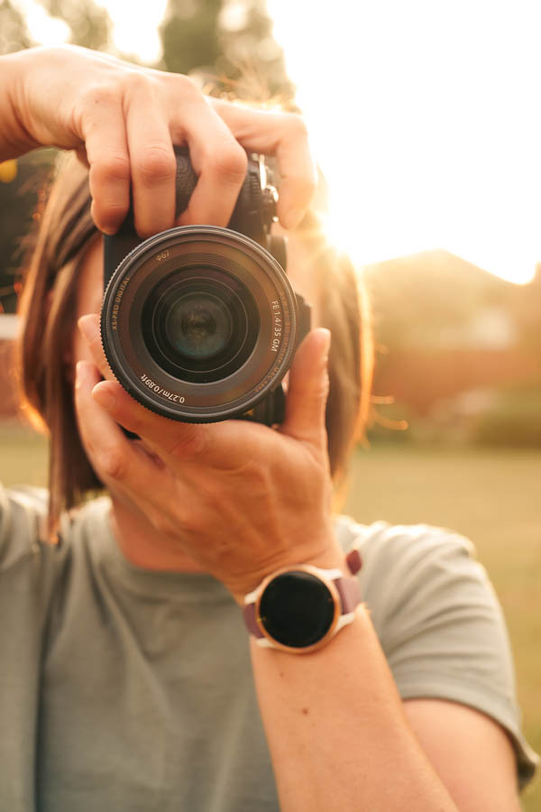 Debbie Kudlo, Seattle brand photographer, with camera on shoot day - Elemental Brand Photography Seattle