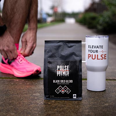 Seattle Product Photography - Pulse Brewed Black Gold Blend Coffee with Runner Lacing Shoes on Sidewalk - Active Lifestyle Pacific Northwest Coffee - Black Diamond - Elemental Brand Photography