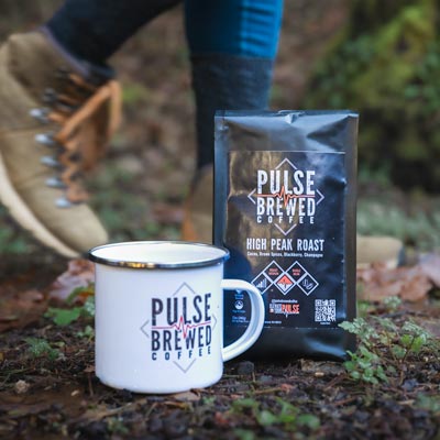 Seattle Product Photography - Pulse Brewed Coffee Bag and Mug with Slow-Shutter Motion of Hiking Boots Passing - Outdoor Adventure Coffee - Black Diamond, WA - Elemental Brand Photography