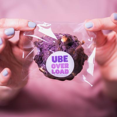 Seattle Product Photography - Hand Holding Ube Overload Cookie in Branded Packaging - Product Launch - Pacific Northwest Artisan Dessert - Ube Overload - Maple Valley, WA - Elemental Brand Photography