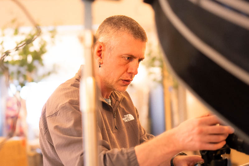 seattle brand photography - Jason adjusts the camera settings during a brand