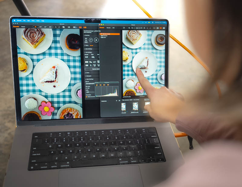 Seattle brand photography - Debbie points at screen while reviewing images