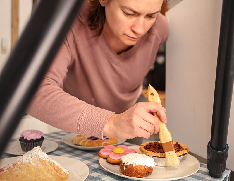 Seattle brand photography - Debbie wipes away debris on subject - Seattle WA