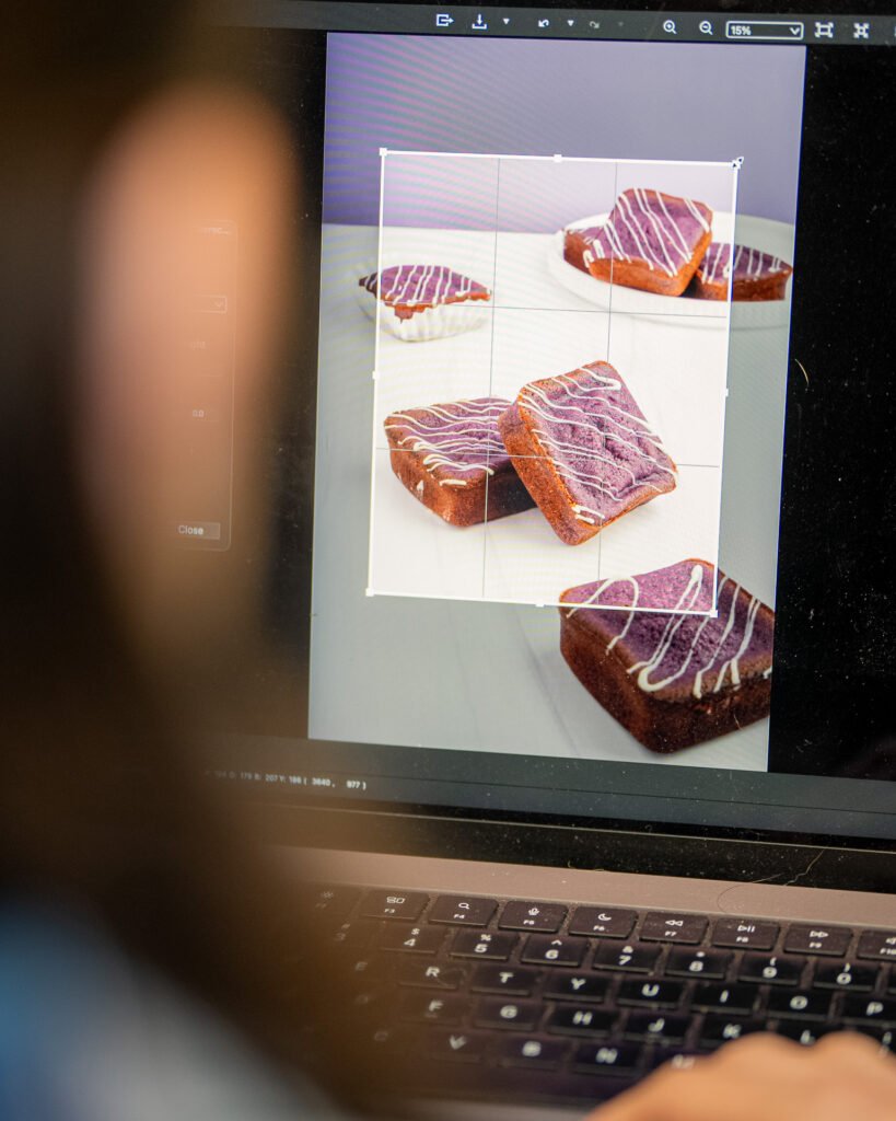 Seattle brand photography. Behind the scenes image of an image of ube mochi being cropped during editing.