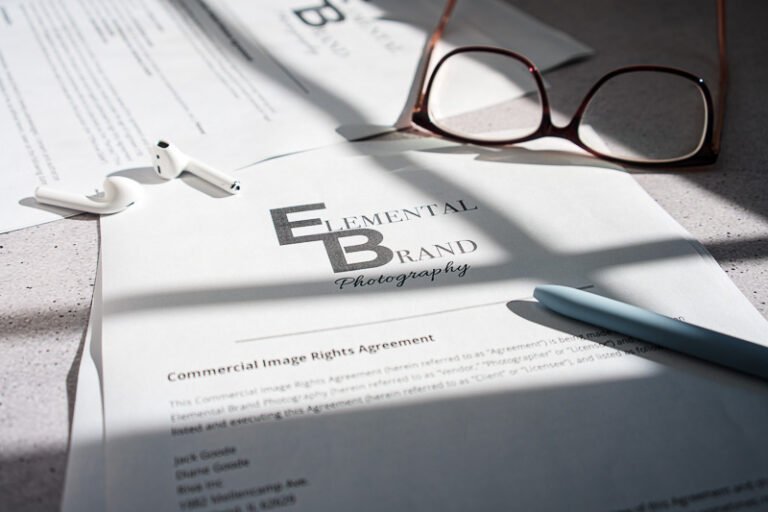 Seattle Brand Photography. Commercial photo license on desk setting with glasses and earbuds.