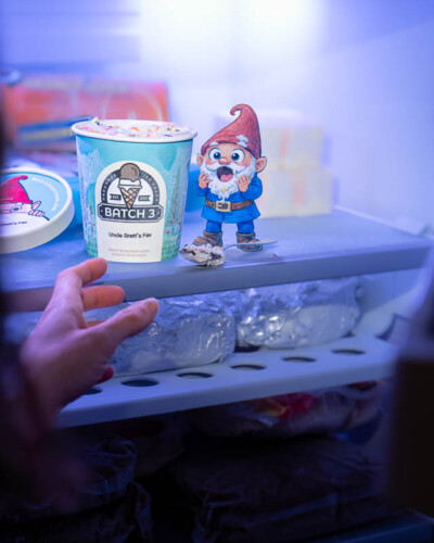 Seattle product photography for Batch 3 Ice Cream in Maple Valley, WA. A playful composite layers hand-sketched gnomes with frozen ice cream product shots — whimsical, brand-authentic social media content for a small-batch Pacific Northwest ice cream maker. Seattle Product Photography - Batch 3 Ice Cream with Hand-Drawn Gnome Composite Stealing Ice Cream from Freezer - Whimsical Small-Batch Ice Cream Brand - Batch 3 Ice Cream - Maple Valley, WA - Elemental Brand Photography