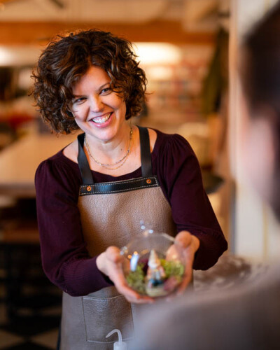 Seattle brand photography for Just A Little Something in Maple Valley, WA. A founder portrait of Deanna, the face behind this curated gift boutique inside House & Hazel - personal brand storytelling content that puts a human face to a Pacific Northwest small business. Seattle Brand Photography - Portrait of Deanna, Founder of Just A Little Something - Maple Valley Curated Gift Boutique - Maple Valley, WA - Elemental Brand Photography