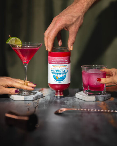Seattle Product Photography for Alpenglow Cocktail Mixers in Issaquah, WA - natural flavors and bright colors served multiple ways in an elegant, soft-lit atmosphere - evergreen marketing content Seattle Product Photography - Marionberry bramble cocktail mixer served in martinis and refreshment glasses - Alpenglow Cocktail Mixers - Issaquah WA - Elemental Brand Photography