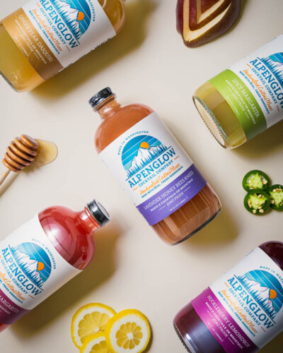 Seattle Product Photography for Alpenglow Cocktail Mixers in Issaquah, WA - fresh ingredients and a variety of refreshing flavors photographed on a bright flatlay - evergreen marketing content for Alpenglow Cocktail Mixers. Seattle Product Photography - collection of fresh cocktail mixers with fresh ingredients flatlay - Alpenglow Cocktail Mixers Issaquah - Elemental Brand Photography