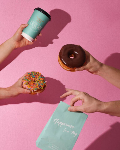 Seattle Product Photography for Crown Donuts in Maple Valley, WA. Bright colored background with well defined shadows from the local, fresh donuts in an advanced composite - created for social media and advertising showcasing product variety in a summertime vibe Seattle Brand Photography - Crown Donuts - Maple Valley, WA - donuts & products composite - Elemental Brand Photography