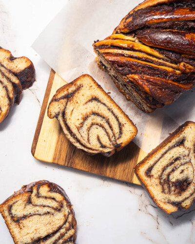 Seattle Product Photography for Emily's Bakery in Maple Valley, WA. Top-down image of fresh, handmade babkah bread showcasing the layers and highlights of the unique desert bread available through the cottage bakery. Captured with natural, even lighting to showcase the contrast and details of the unique baked item available at the local Maple Valley Farmer's market Seattle Product Photography - Emily's Bakery - Maple Valley, WA - Babkah bread flatlay - Elemental Brand Photography