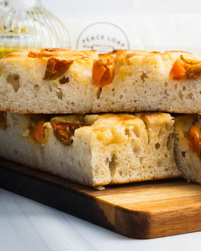 Seattle product photography for Peace Loaf in Maple Valley, WA. A macro detail shot of Sea Salt and Tomato focaccia captures the layered air bubbles and crust texture of this naturally leavened bread - craft-forward product photography for a Pacific Northwest artisan bakery. Seattle Product Photography - Macro Detail of Peace Loaf Sea Salt and Tomato Focaccia Showing Air Bubble Texture - Artisan Bakery - Peace Loaf - Maple Valley, WA - Elemental Brand Photography