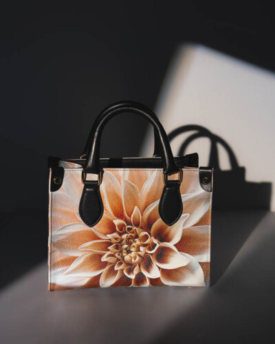 Seattle product photography for Sally's Blooming Bags in Maple Valley, WA. A single floral tote sits in a doorway lit by structured light - minimalist product photography that lets the quality and design of this Pacific Northwest artisan bag brand speak for itself. Seattle Product Photography - Sally's Blooming Bags Leather Floral Mini Bonchurch Shopper Tote in Doorway Accented by Natural Light - Artisan Reusable Bags Pacific Northwest - Sally's Bags - Maple Valley, WA - Elemental Brand Photography