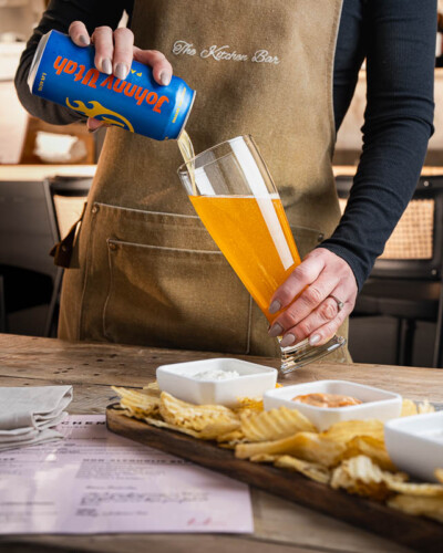 Seattle restaurant photography for House & Hazel in Maple Valley, WA. A Georgetown Brewery beer pour in action at the House & Hazel bar - beverage photography showcasing this Maple Valley destination's commitment to featuring local Pacific Northwest craft breweries. Seattle Restaurant Photography - Georgetown Brewery Beer Pour at House and Hazel Bar - Maple Valley Restaurant Featuring Local Craft Beer - Maple Valley, WA - Elemental Brand Photography