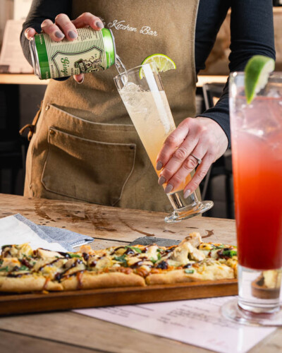 Seattle restaurant photography for House & Hazel in Maple Valley, WA. A mocktail mixer pour in action captures movement and craft - bar photography for a Pacific Northwest destination known for its elevated, community-centered dining and beverage experience. Seattle Restaurant Photography - House and Hazel Mocktail Mixer Being Poured - Maple Valley Bar and Restaurant - Maple Valley, WA - Elemental Brand Photography