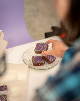Product photoshoot for Ube Overload - Kent, WA - Ube Butter Mochi is styled with attention to detail and leading lines as the product image is constructed - Elemental Brand Photography. Elemental Brand Photography - Behind the Scenes - Product styling for Ube Butter Mochi product image - Maple Valley, WA